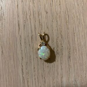 Australian solid opal and diamond 14k gold pendant